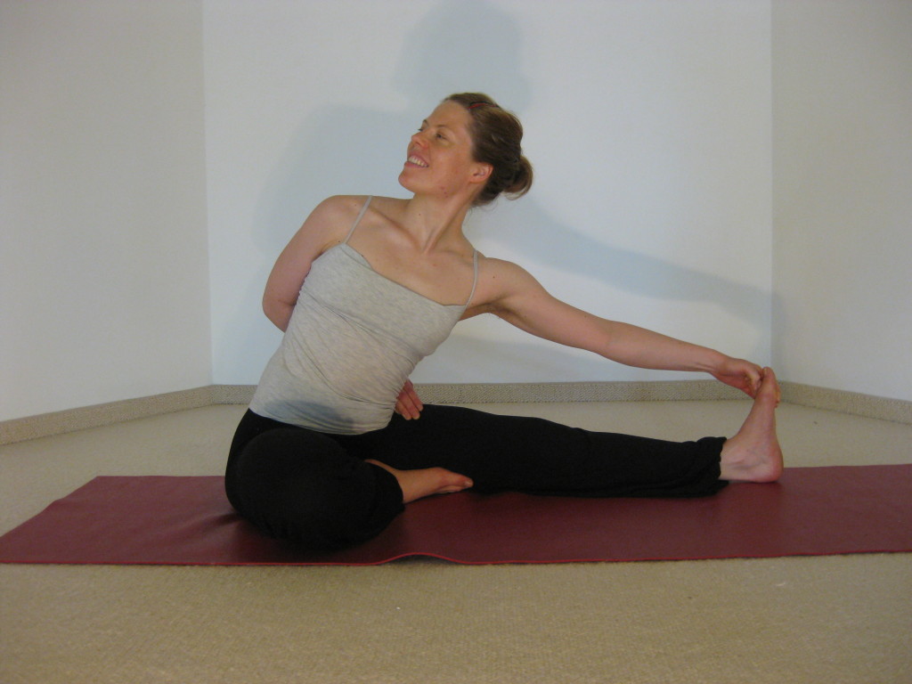 twisted seated forward bend yoga pose